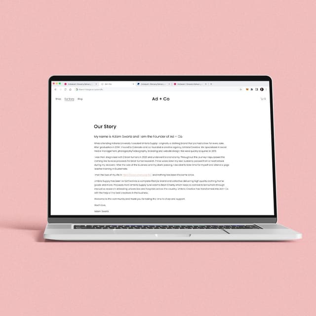 A laptop on a pink background showing the Ad + Co website’s Our Story page.