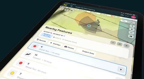 A tablet listing nearby records, overlays and photos by distance.