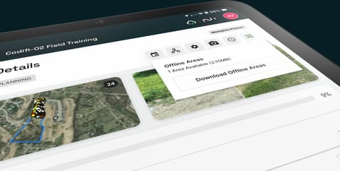 A tablet downloading an offline map area for a project.
