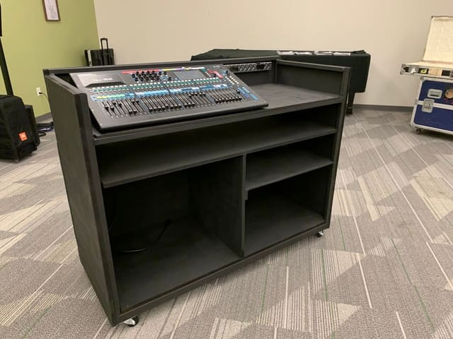 The finished cart: a black rolling cabinet with a large digital mixing console set into its angled top.